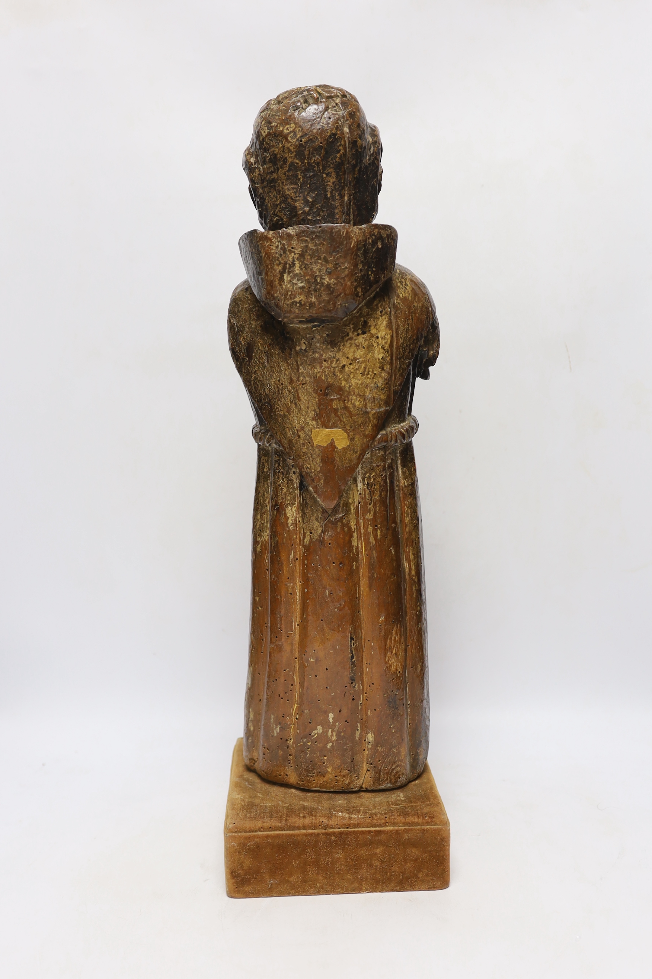 An oak carved monk with polychrome face, 54cm high